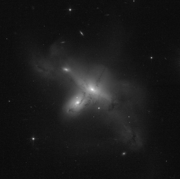 ARP-MADORE2115-273: a rare interacting galaxy pair.